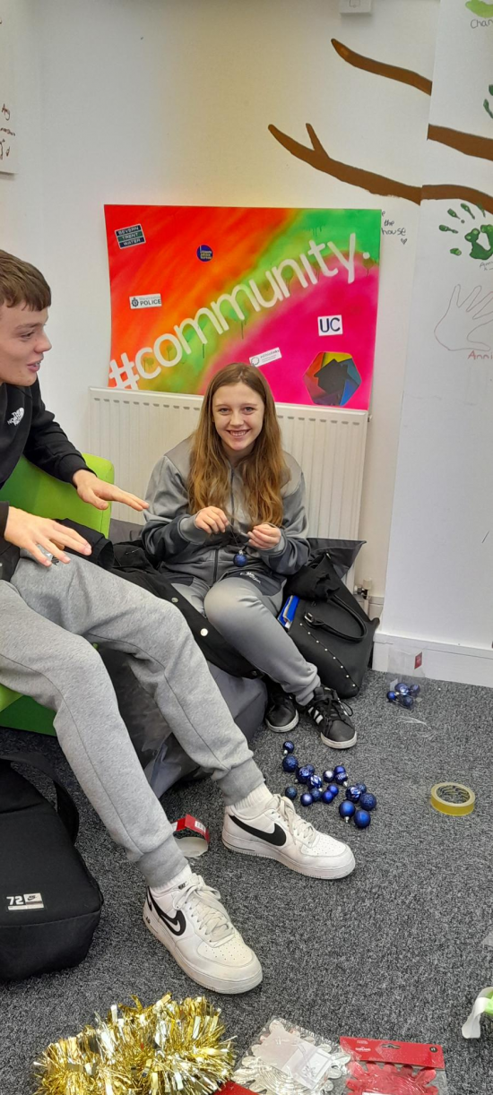 Young people decorating the House Project at Christmas